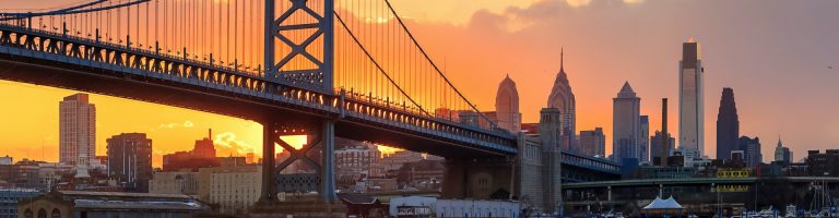Philadelphia skyline with the Ben Franklin Bridge at sunset