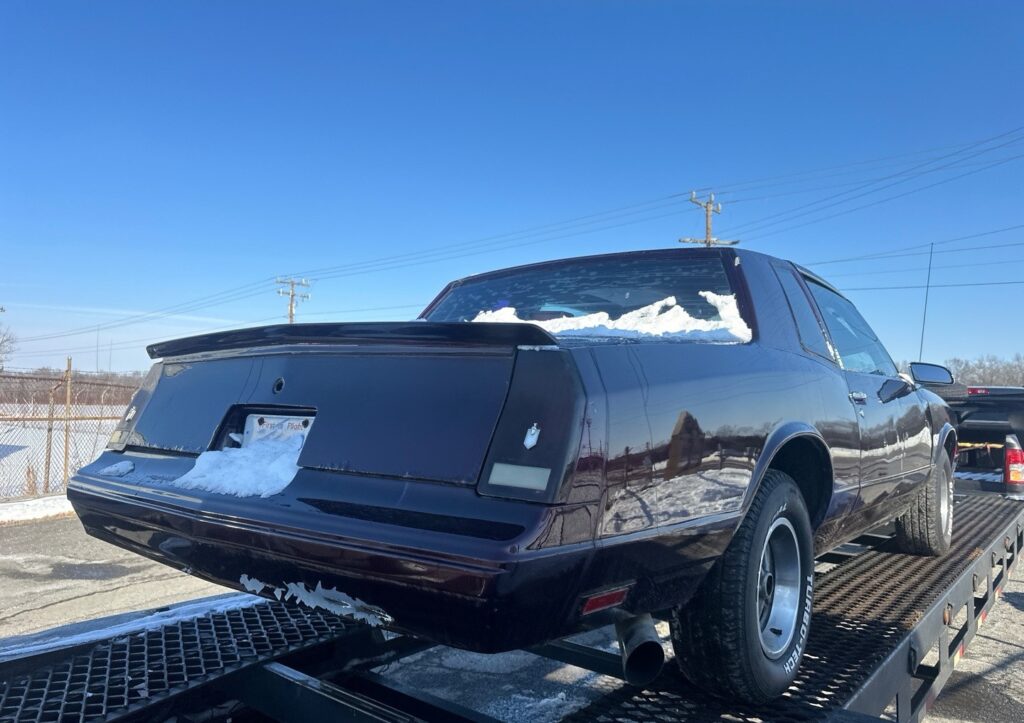 1987 Chevrolet Monte Carlo in an open trailer