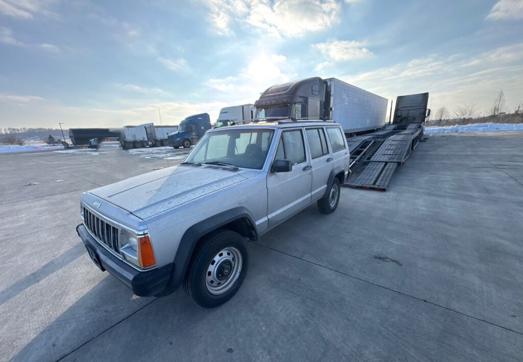 1992 Jeep Cherokee with an open trailer