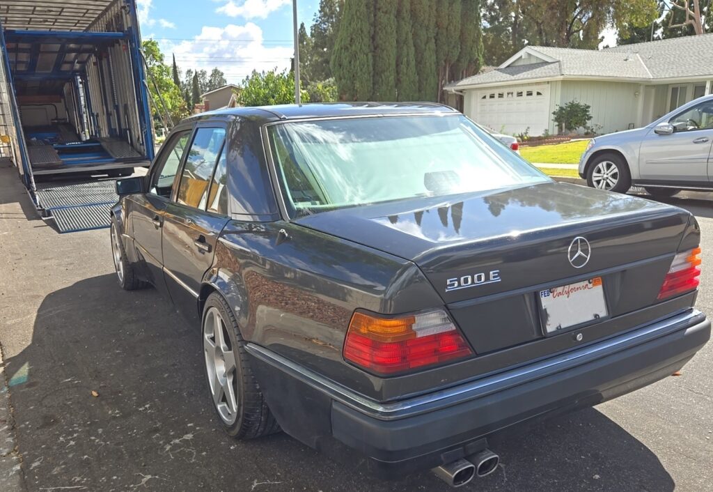 1992 Mercedes-Benz E-Class with an enclosed trailer