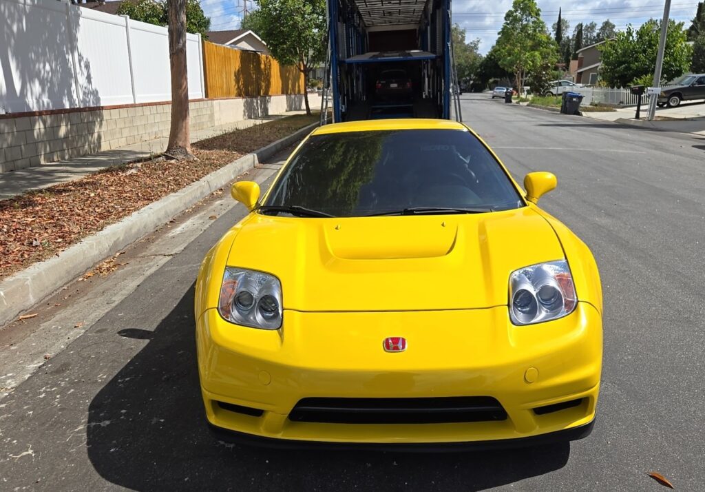 1997 Acura NSX with an enclosed trailer