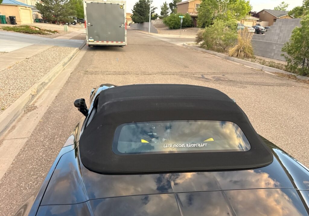 2016 Chevrolet Corvette with an enclosed trailer