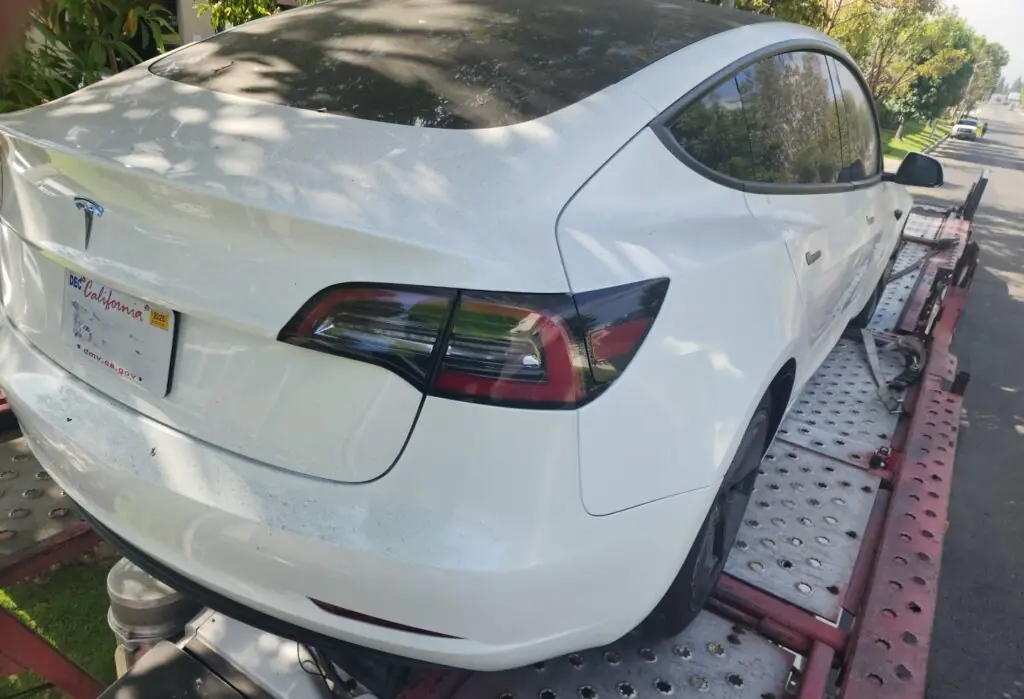2023 Tesla Model 3 in an opentrailer