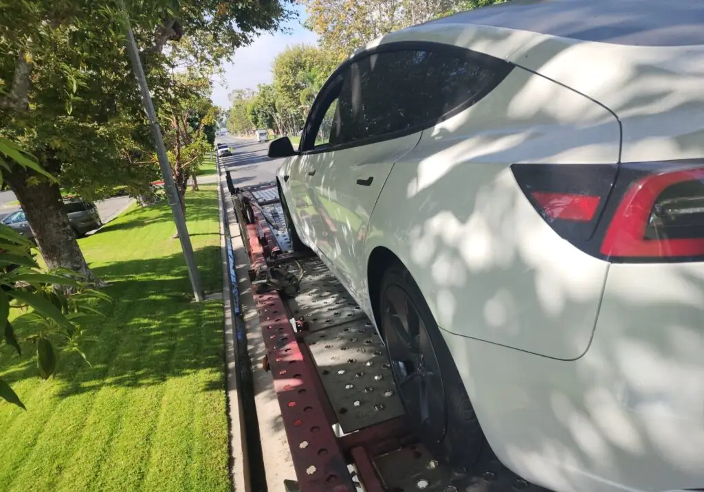 2023 Tesla Model 3 on trailer